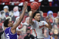 Texas Tech's Kyler Edwards (11) passes the ball during the first half of the team's NCAA college basketball game against TCU in Lubbock, Texas, Tuesday, March 2, 2021. (AP Photo/Justin Rex)