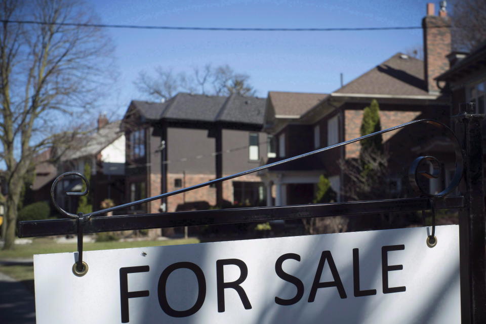 A report by Royal LePage say the pace of rising home prices slowed in Canada in the second quarter due to softness in the Greater Toronto Area market. A for sale sign is shown in front of west-end Toronto homes Sunday, April 9, 2017. THE CANADIAN PRESS/Graeme Roy