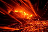 <p>Embers blow in the wind as a Camp Fire burns a KFC restaurant on Nov. 8, 2018 in Paradise, Calif.<br>(Photo from Justin Sullivan, Getty Images) </p>