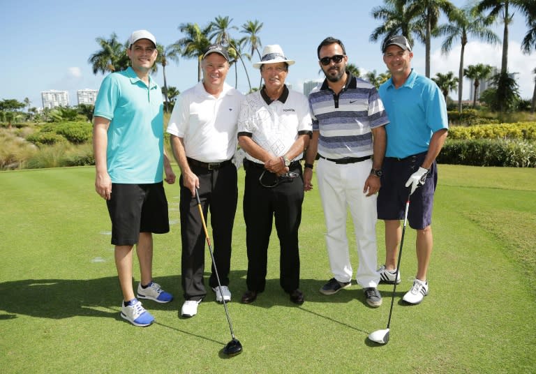 Chi Chi Rodriguez (center) poses with guests at a celebrity chef tournament in Florida in 2019 (Alexander Tamargo)