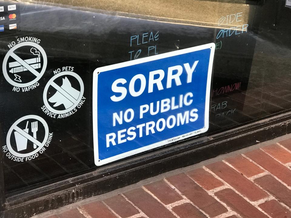 A coffee shop warns customers that it does not have a public restroom. A bill introduced by Rep. Mia Ackerman, D-Cumberland, would allow people with certain medical conditions to use employee bathrooms.