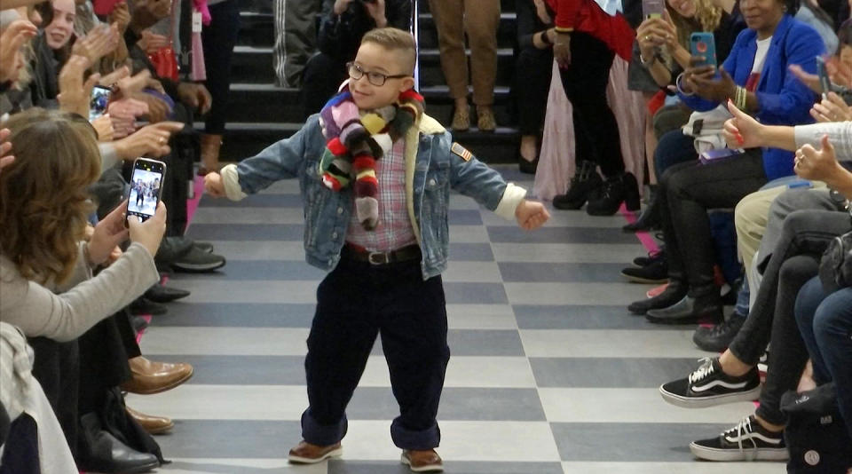 This image from video taken on Wednesday, Oct. 16, 2019 shows a boy participating in the 2nd annual “Gigi’s Playhouse Fashion Show” in New York. Gigi’s Playhouse is an education and achievement center that prepares young people with Down syndrome to engage more fully in their homes, schools and communities. (AP Photo/Gary Gerard Hamilton)
