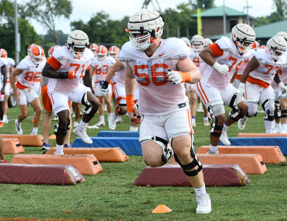 The Clemson Tigers held football practice at the school's football practice fields in Clemson on Friday, August 12, 2022.  Clemson offensive lineman Will Putnam (56) Tigers goes through drills on the field. 