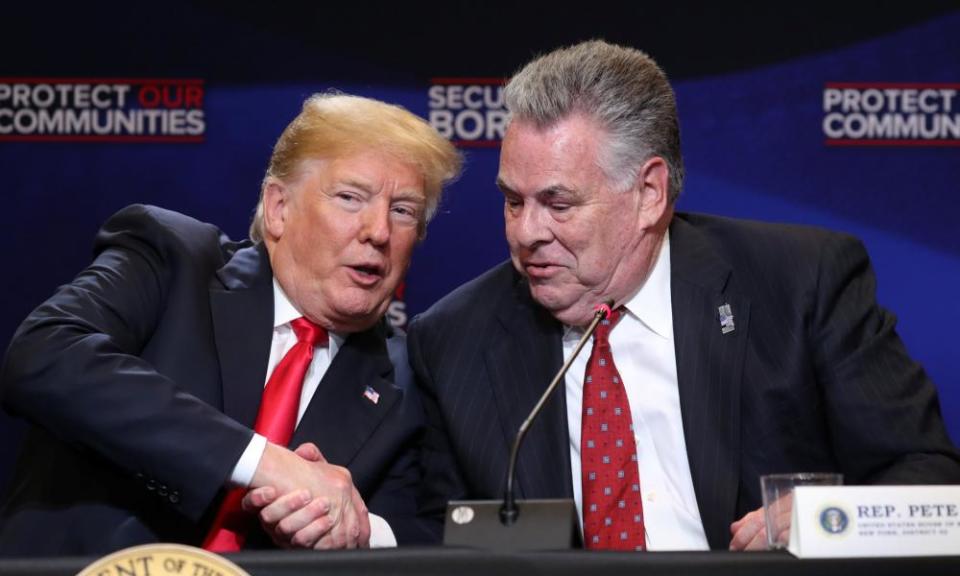 Donald Trump shakes hands with Peter King at a roundtable on immigration in Bethpage, New York this week.