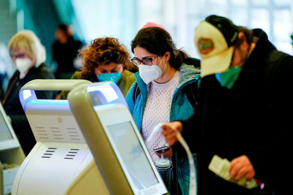 Wearing masks at the Philadelphia airport on April 19, 2022.