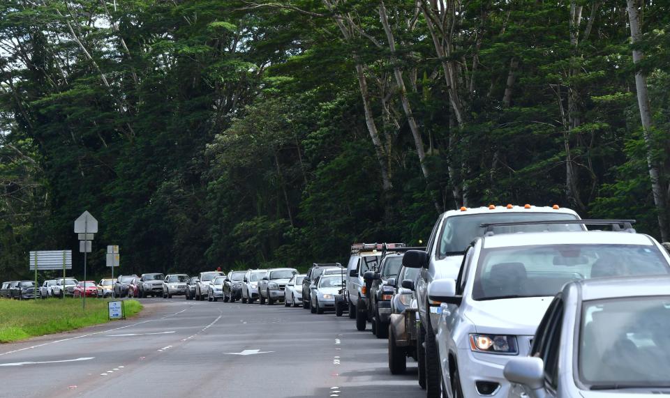 Vehicles head for the intersection of Pahoa and Kapoho roads as evacuees are allowed to return to their Leilani Estates homes to gather belongings on Sunday.