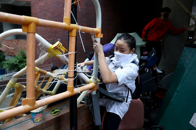 A protester tries to leave the Hong Kong Polytechnic University campus