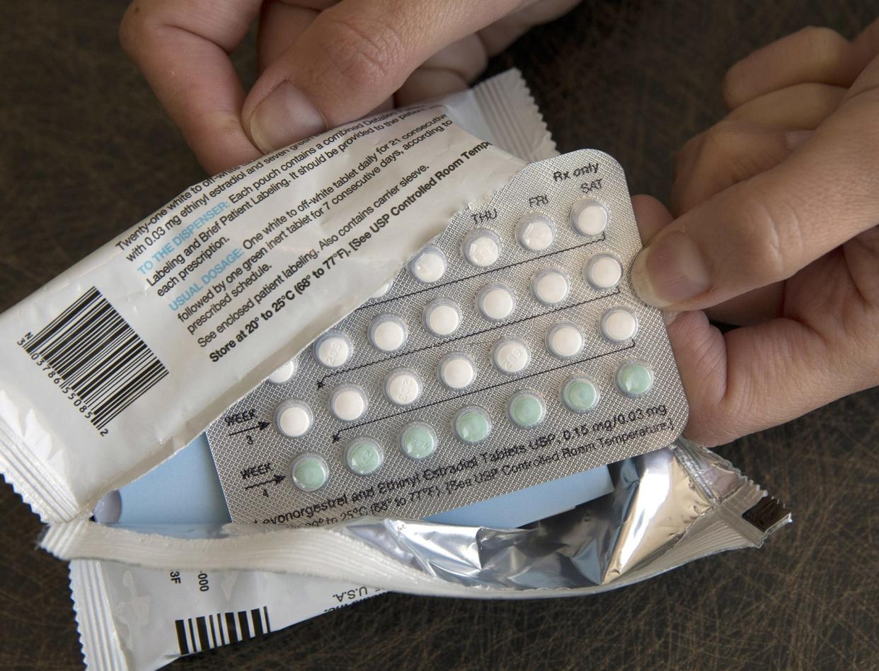 FILE - In this file photo, a one-month dosage of hormonal birth control pills is displayed.