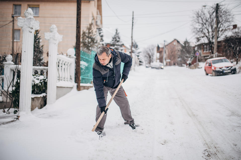 Experts reveal who is at risk of experiencing a heart attack while shovelling snow. (Image via Getty Images)