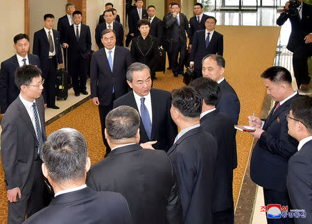 China's state councillor Wang Yi greets people during his visit in Pyongyang in this photo released by North Korea's Korean Central News Agency (KCNA) in Pyongyang on May 3, 2018. KCNA/via REUTERS