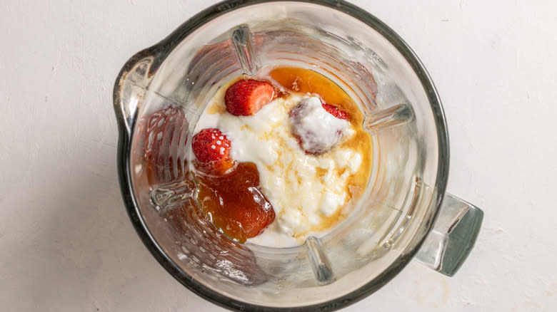 strawberries and yogurt in blender