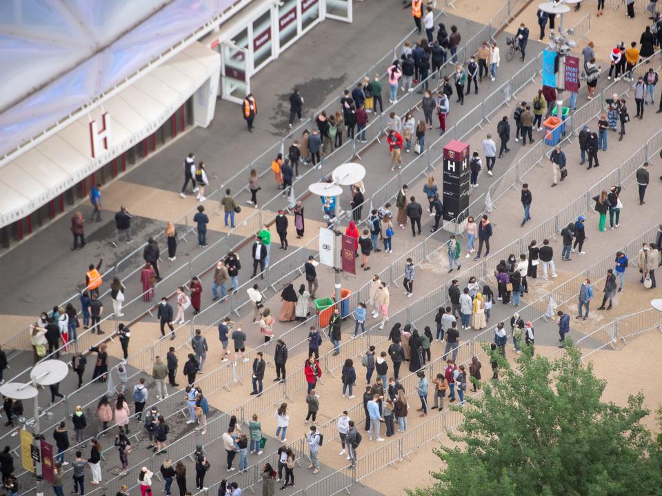 Long queues formed outside an NHS vaccination clinic at West Ham’s London Stadium in Stratford, east London (PA)