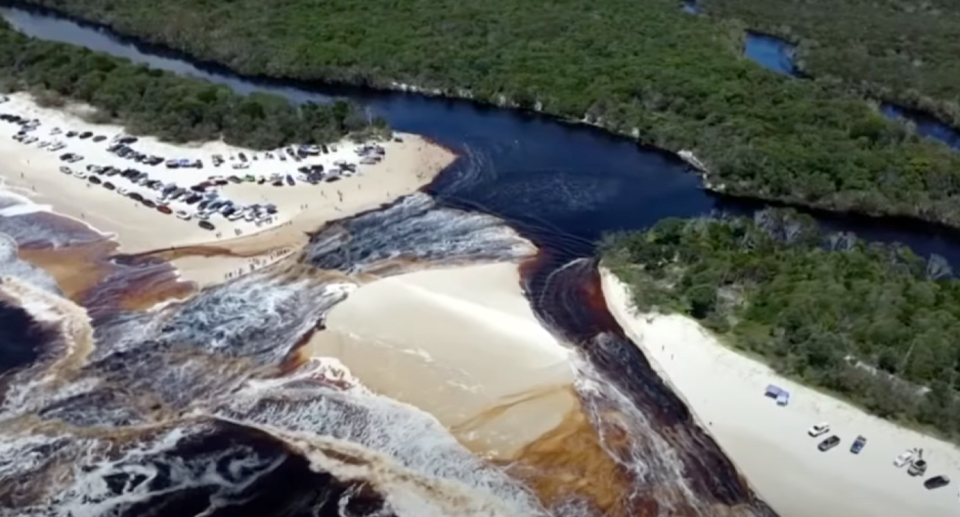 An aerial view of Bribie Island lagoons bursting.