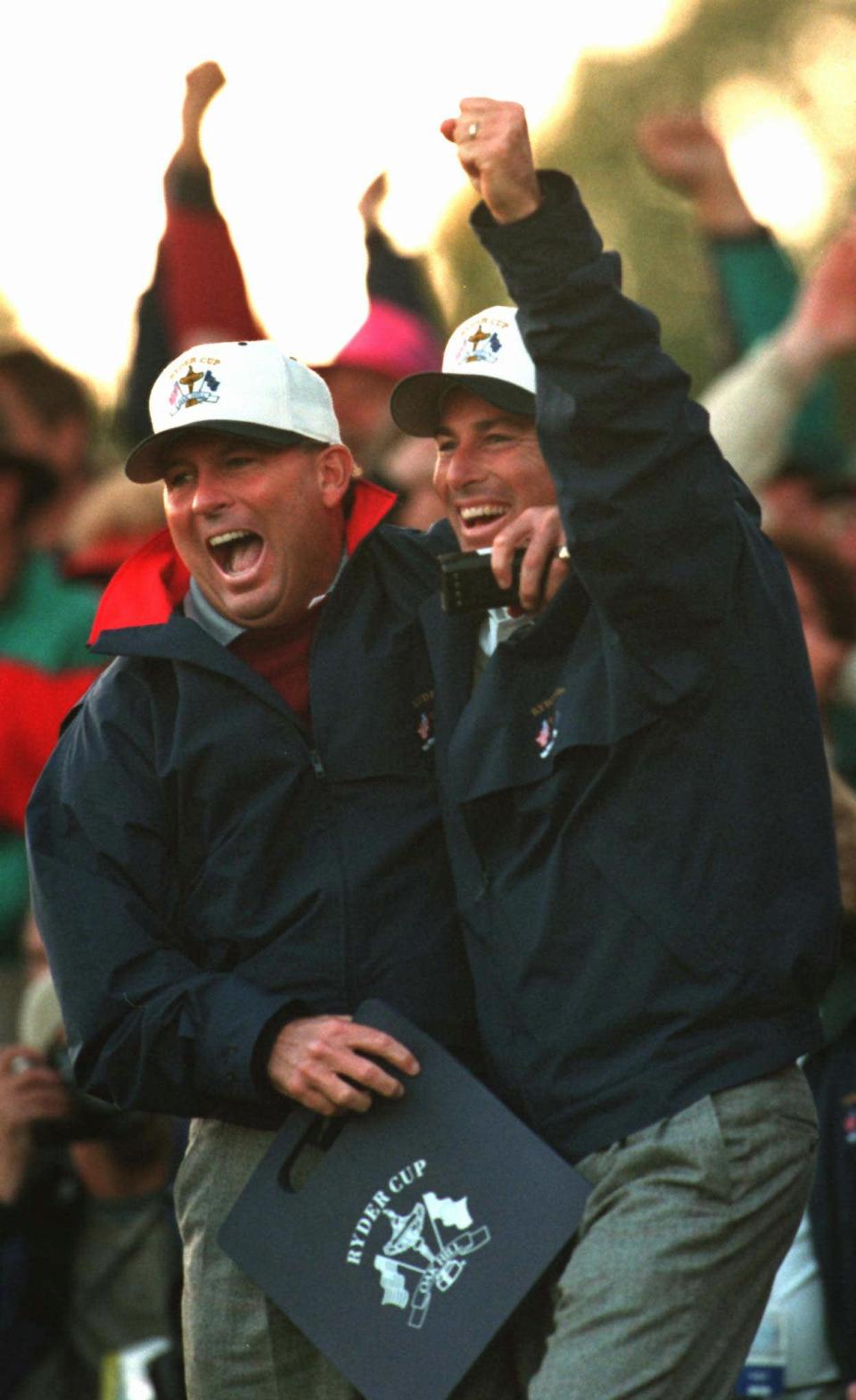 American team captain Lanny Wadkins (left) and Curtis Strange celebrate after Corey Pavin chips in to win the 18th hole and the match Saturday afternoon. (Photo: Jamie Germano/Rochester Democrat & Chronicle/USA Today Network)