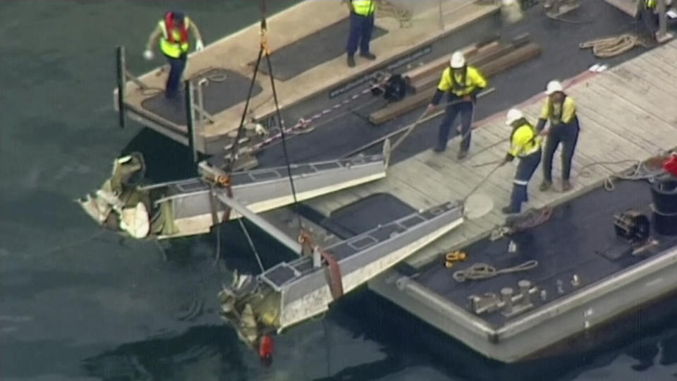 <em><span class="s1">Wreckage of the De Havilland DHC-2 Beaver was lifted out of the Hawkesbury River by a crane barge (AP)</span></em>