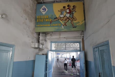 Sportsmen train at the premises of a local stadium in the southern city of Stavropol, Russia, November 10, 2015. REUTERS/Eduard Korniyenko