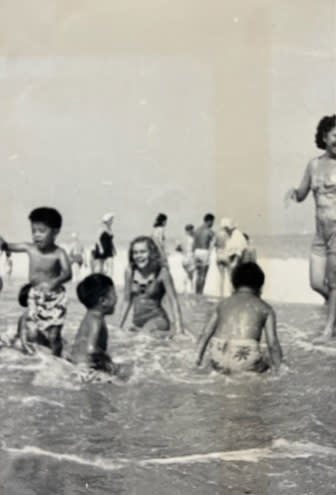 Large groups of Chinese American families and friends would set up their beach umbrellas while the children would paddleboard, attempt to surf the waves and play ball. (Courtesy David Liu)