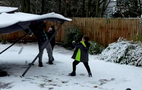 This is the moment a dad tried to cover his kids in snow from the top of his gazebo - only for it to completely collapse on top of him. Daniel Campbell, 34, tried to scrape off a bit of snow that had settled on the roof of the structure onto his kids Kacey, 15, Finley, 10, and Nate, seven, while wife Lucy, 34, filmed. But after failing to give them the shower he desired, his plan backfired and the gazebo collapsed on his head, leaving the whole family in hysterics.