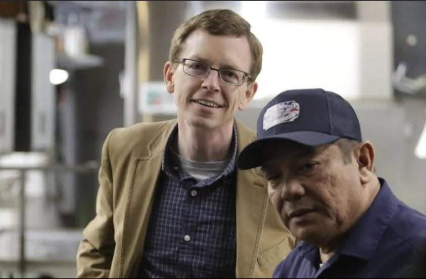 U.S. Rep. Dusty Johnson, R-S.D., smiles as Wall Meat Processing owner Ken Charfauros conducts a tour of the processing plant in Wall in March.