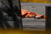 <p>The feet of a victim are pictured at the scene of an incident where a van struck multiple people on Yonge Street in Toronto, Ontario, Canada, April 23, 2018. (Photo: Carlo Allegri/Reuters) </p>