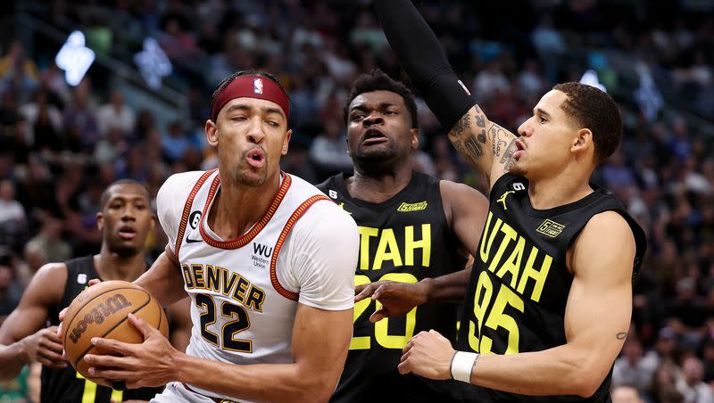 Denver Nuggets forward Zeke Nnaji (22) battles Utah Jazz center Udoka Azubuike (20) and Utah Jazz forward Juan Toscano-Anderson (95) as he goes for a shot as Utah and Denver play at Vivint Arena in Salt Lake City on Saturday, April 8, 2023. Jazz won 108-104.