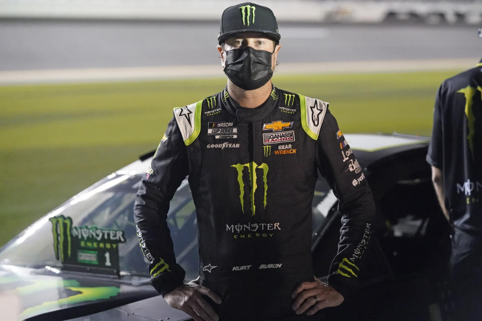 Kurt Busch stands by his car on pit road during qualifying for the NASCAR Daytona 500 auto race at Daytona International Speedway, Wednesday, Feb. 10, 2021, in Daytona Beach, Fla. (AP Photo/John Raoux)