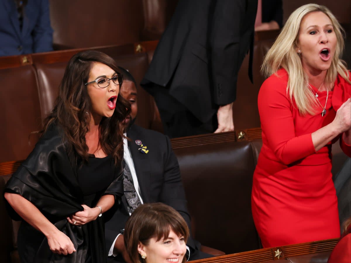 U.S. Rep. Lauren Boebert (R-CO) and Rep. Marjorie Taylor Greene (R-GA) scream "Build the Wall" as U.S. President Joe Biden delivers the State of the Union address during a joint session of Congress  (Getty Images)