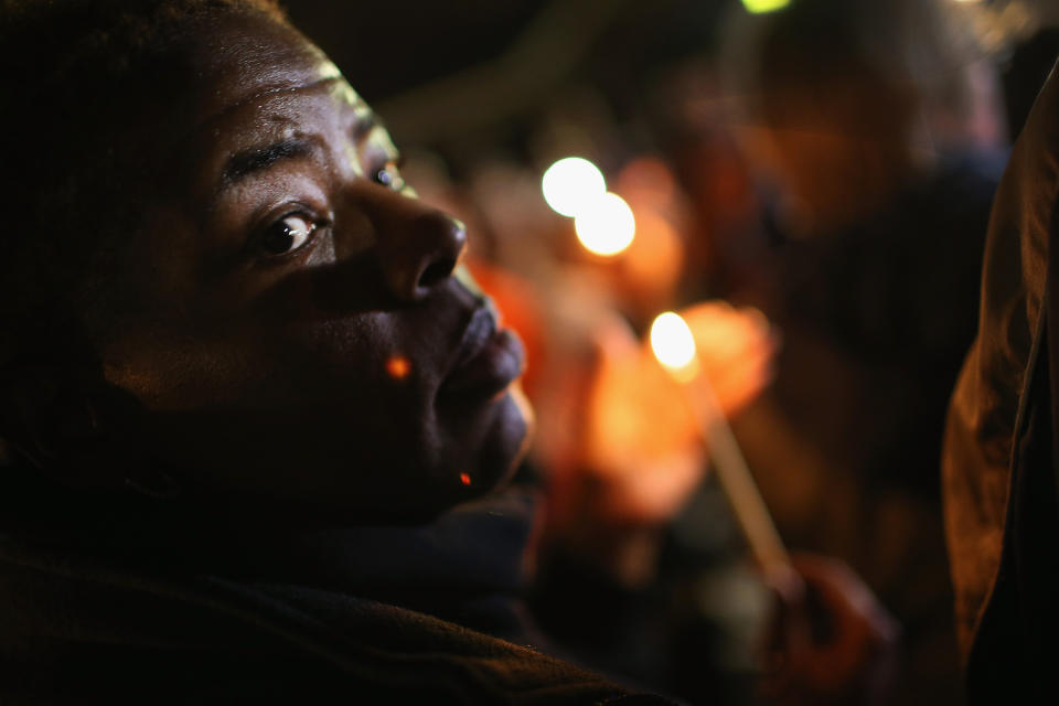 Demonstrators hold a prayer service near the police station on March 12, 2015 in Ferguson, Missouri. Prayers were said for both demonstrators and police at the service. Yesterday two police officers were shot while observing a protest outside the police station. Ferguson has faced many violent protests since the August shooting death of Michael Brown by a Ferguson police officer. 