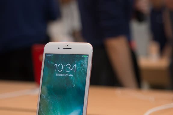 An iPhone on display in the Apple Store