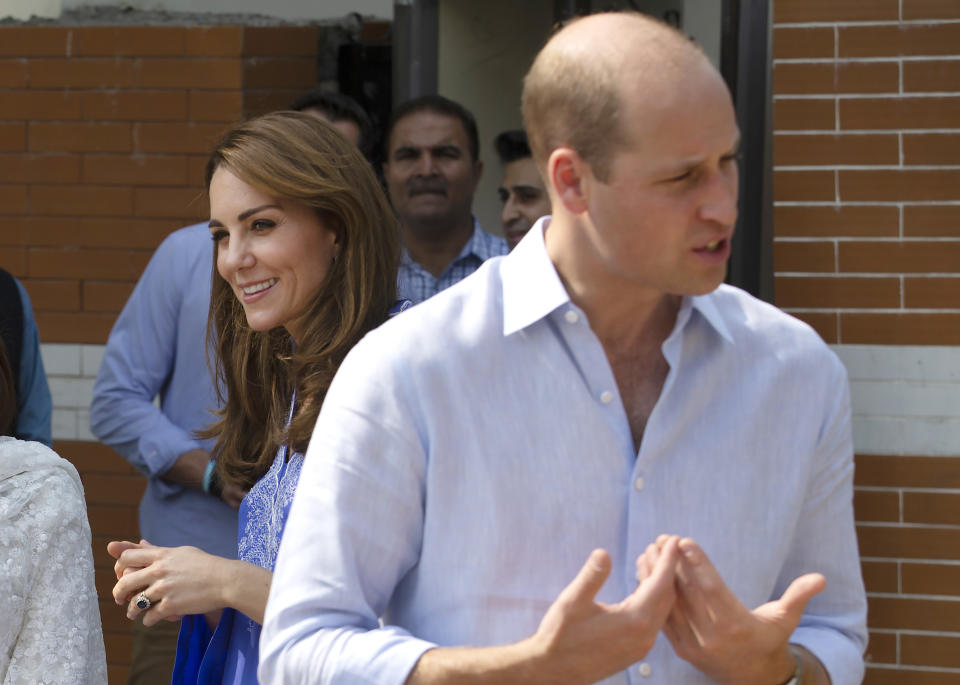 Britain's Prince William and his wife Kate meet with teachers during their visit to a school in Islamabad, Pakistan, Tuesday, Oct. 15, 2019. The Duke and Duchess of Cambridge, who are strong advocates of girls' education were greeted by teachers and children. (AP Photo/B.K. Bangash)