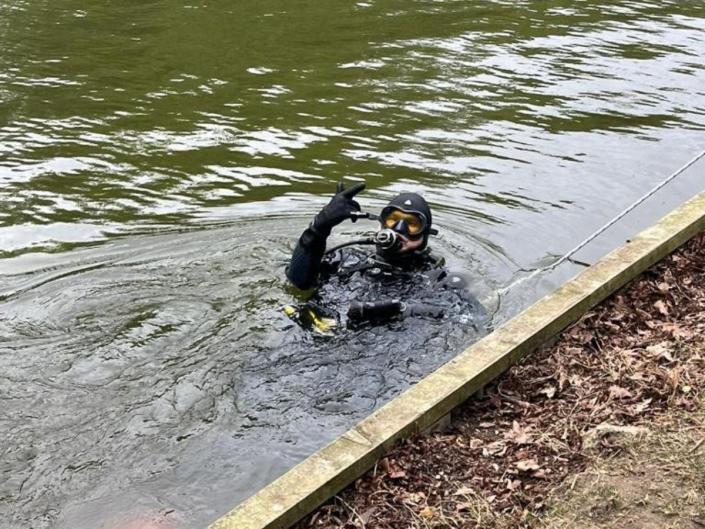 A scuba diver is seen in the River Great Ouse. (SWNS)