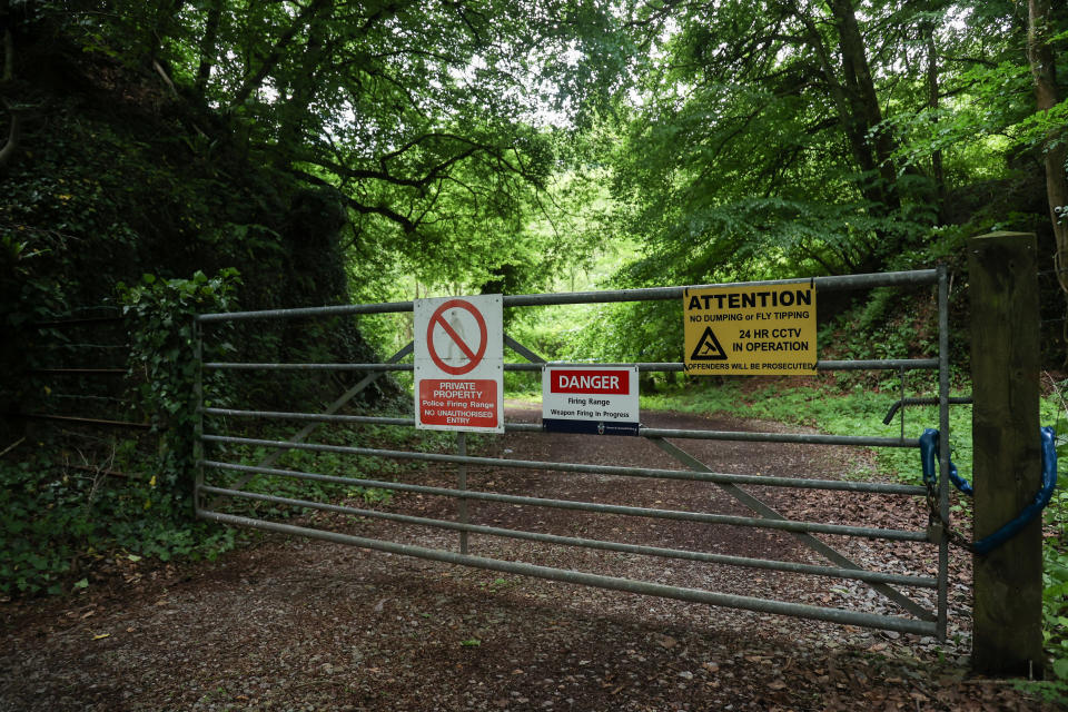 The entrance to the firing range. See SWNS story SWPLgunfire. This is the moment a mum confronts armed police on a firing range next to her home - which the family discovered didn't even have planning permission. Corin Chislett, 34, was able to wander up to cops wielding massive guns - demanding they stop. Corin, 34, and husband Rob, 48, are in the middle of Britain's most explosive neighbour dispute - with local armed officers. Rob and Corin say their children are afraid to go outside as cops fired high-calibre guns up to four times a week - without a permit.  