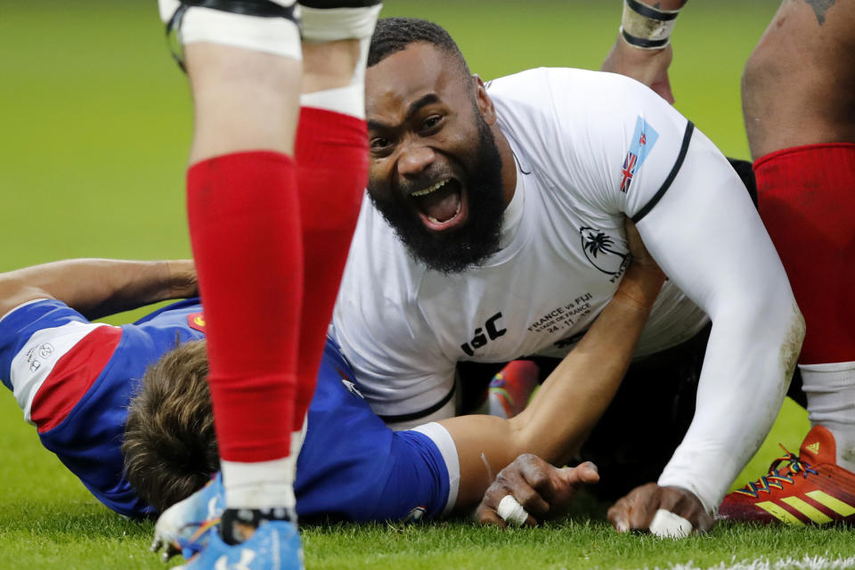 FILE - In this Nov. 24, 2018, file photo, Fiji's Semi Radradra celebrates after scoring a try against France during a rugby international between France and Fiji at Stade de France in Paris. Teams from the Pacific islands are immensely popular around the world and their appearances at the Rugby World Cup are likely to attract large and admiring crowds. But an appreciative welcome won't disguise the fact that the Pacific nations begin the tournament under a considerable handicap. (AP Photo/Christophe Ena, File)