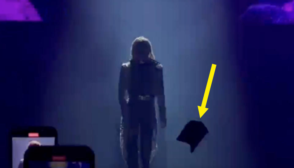 arrow pointing at a large object making its way toward the stage