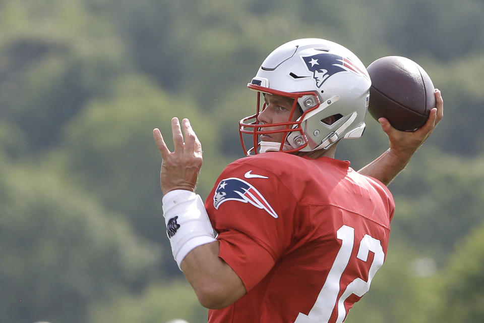 New England Patriots quarterback Tom Brady winds up to pass during an NFL football training camp practice, Thursday, Aug. 1, 2019, in Foxborough, Mass. (AP Photo/Steven Senne)