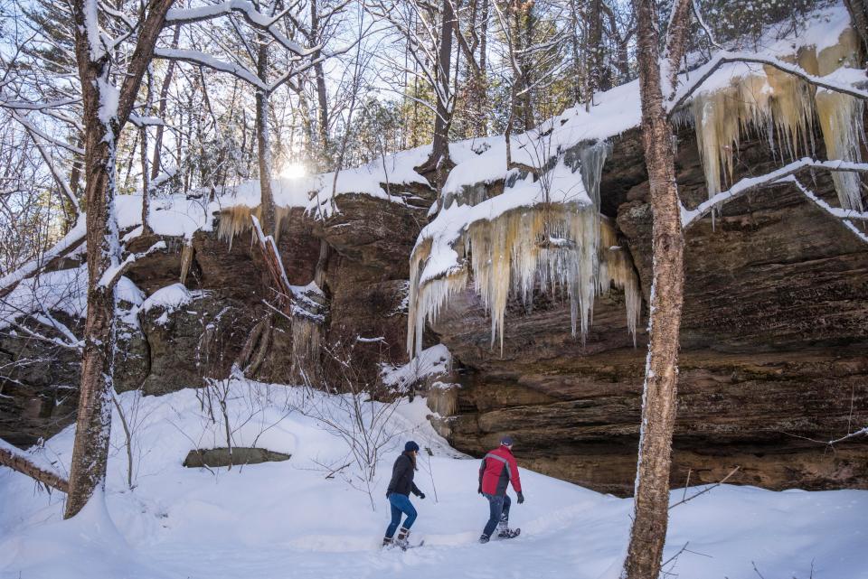 Ice builds up on sandstone rock formations at Mirror Lake State Park in the winter, making for beautiful snowshoeing.