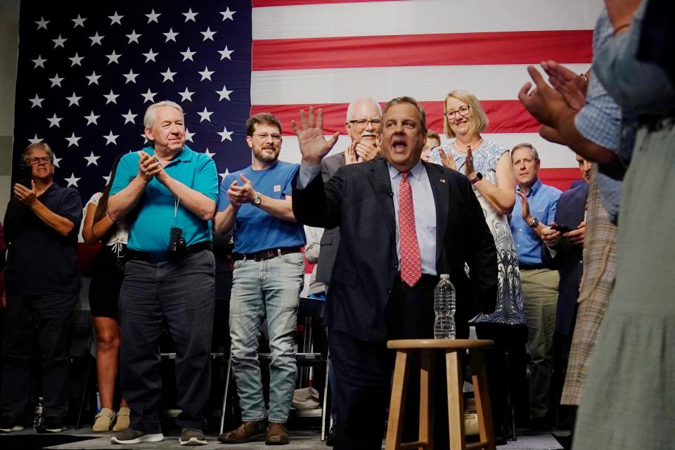 Republican Presidential candidate former, New Jersey Gov. Chris Christie waves to guests during his introduction at a gathering, Tuesday, June 6, 2023, in Manchester, N.H.