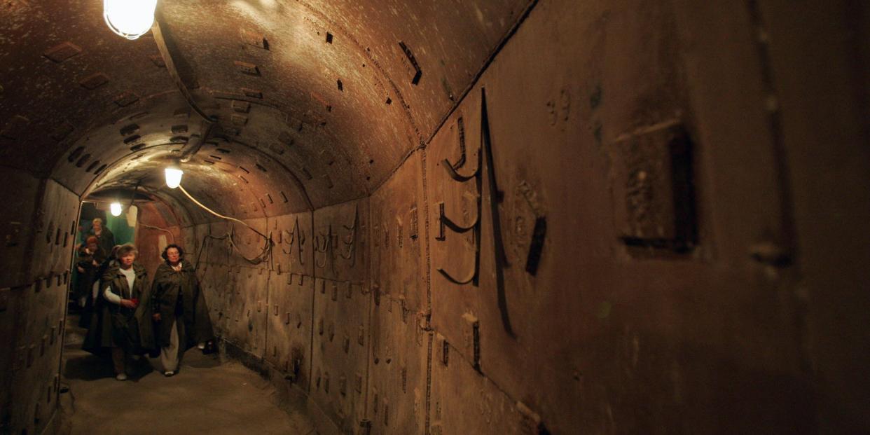 People walk along a passageway in an underground shelter in Moscow, Russia, in June 2007.