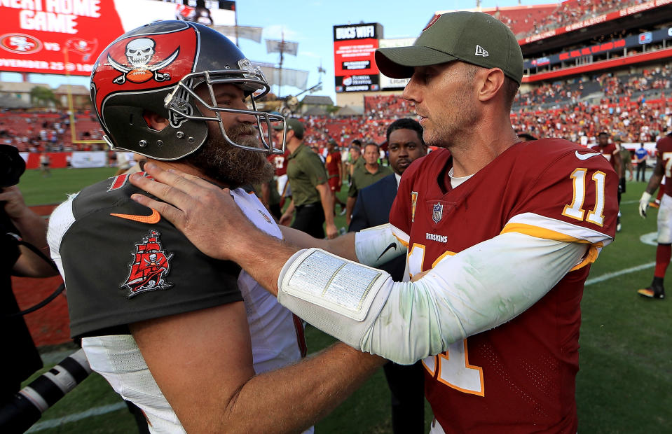 TAMPA, FL - NOVEMBER 11:  Ryan Fitzpatrick #14 of the Tampa Bay Buccaneers and Alex Smith #11 of the Washington Redskins shake hands during a game  at Raymond James Stadium on November 11, 2018 in Tampa, Florida.  (Photo by Mike Ehrmann/Getty Images)
