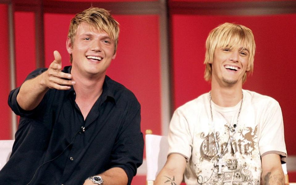 Nick Carter, left, and his younger brother Aaron speak during a press tour in California in July 2006 - Frederick M. Brown/Getty