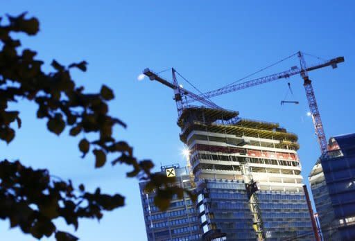 Construction cranes on the site of the new Raiffeisen building to be completed in Vienna. The eurozone veered towards a prolonged recession with new growth figures out on Tuesday showing its economy shrinking again and analysts warning of falling output right through 2013