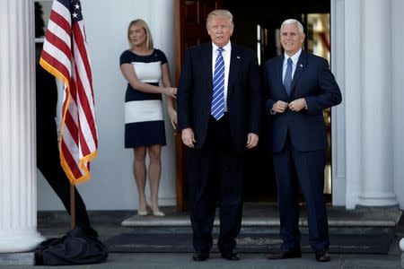 U.S. President-elect Donald Trump ad Vice President-elect Mike Pence stand together as they arrive at the the main clubhouse at Trump National Golf Club in Bedminster, New Jersey, U.S., November 19, 2016. REUTERS/Mike Segar