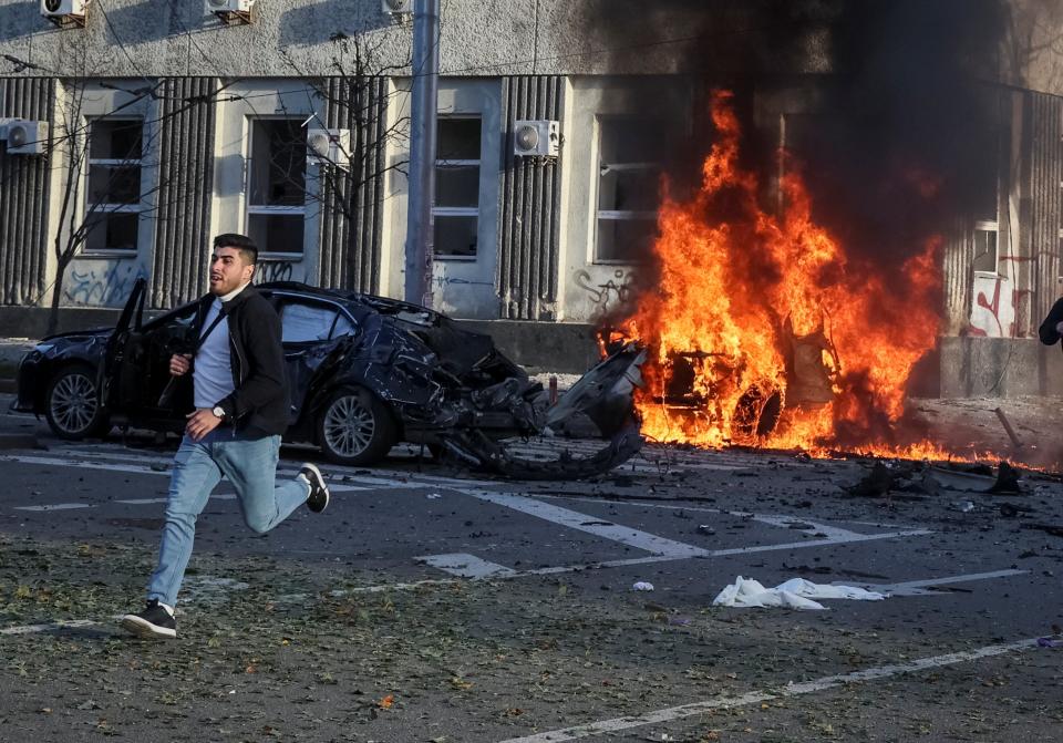 Cars burn after Russian military strikes in central Kyiv (REUTERS)