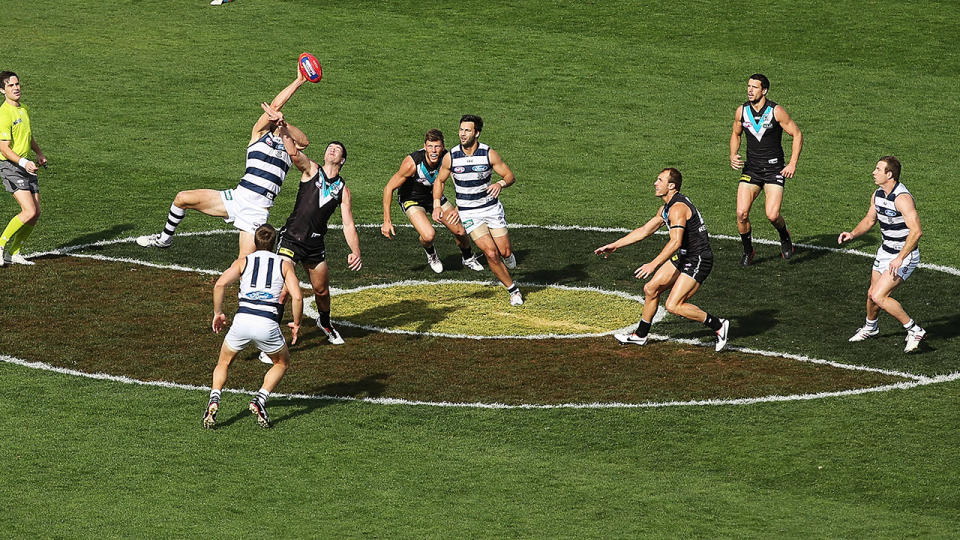 The Aboriginal flag, pictured here painted on the ground for Indigenous Round.