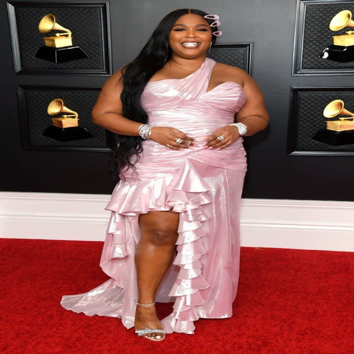 Lizzo smiles on the Grammy's red carpet