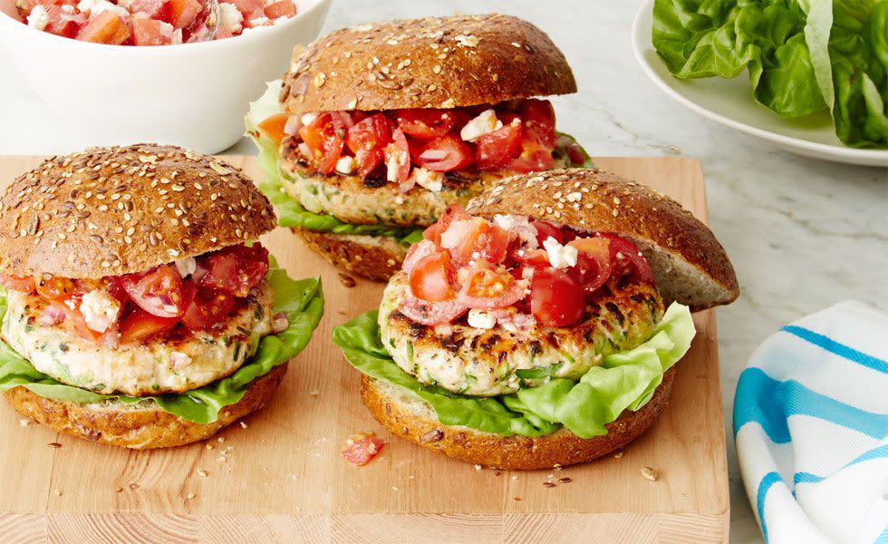 heart healthy recipes greek turkey burgers with lettuce and tomato feta salad on a burger gun