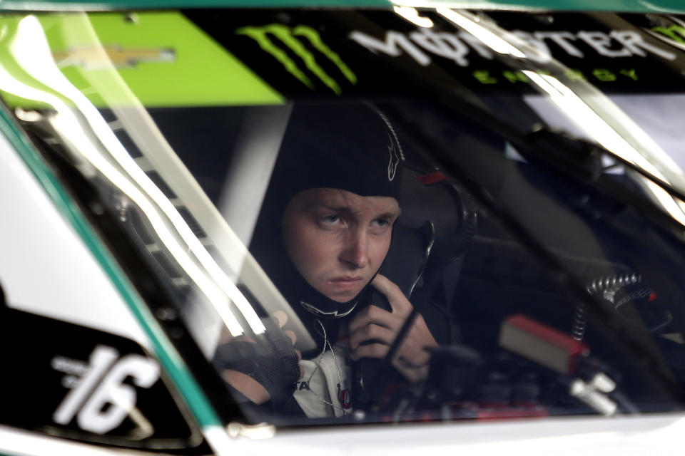 Pole winner William Byron sits in his car during practice for Sunday's NASCAR Cup Series auto race at Charlotte Motor Speedway in Concord, N.C., Saturday, Sept. 28, 2019. (AP Photo/Wesley Broome)