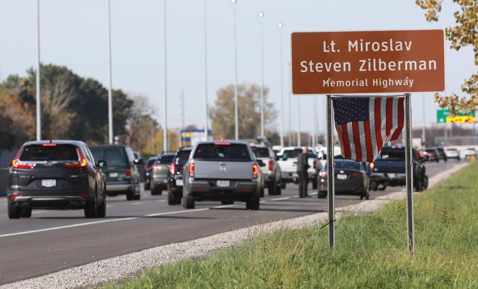 A highway signing memorializing Lt. Miroslav Stephen Zilberman stands on I-270 near the Sawmill Road exit. 