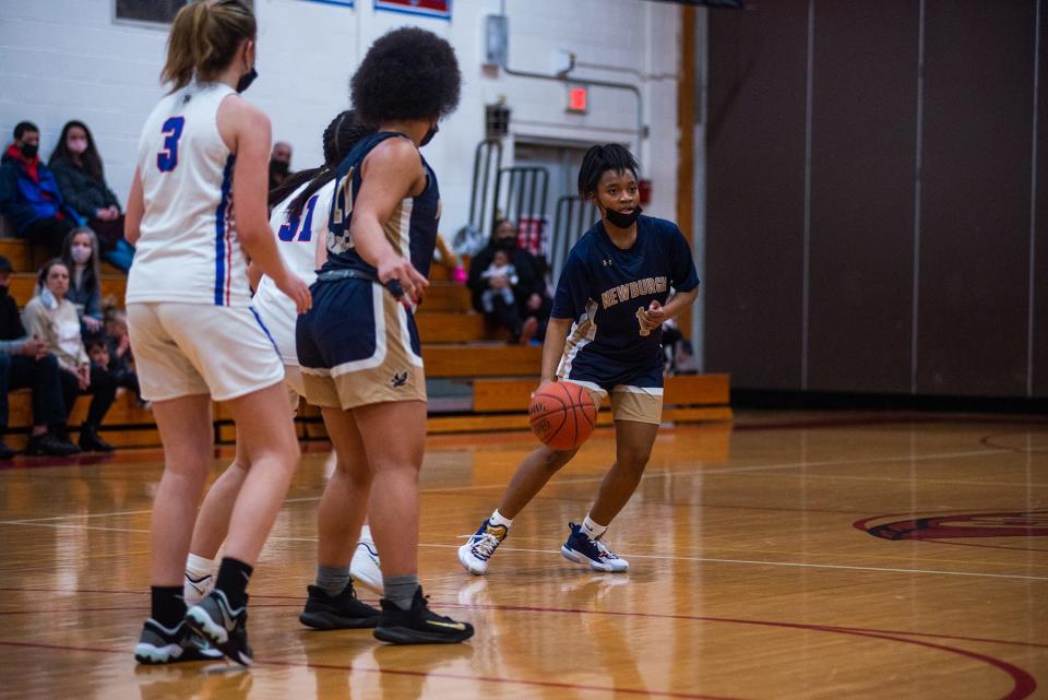 Newburgh's Terri'nashjae Burden dribbles down court during the Section 9 basketball game at Goshen Central High School in Goshen, NY on Saturday, February 5, 2022.Newburgh defeated Goshen 58-30. KELLY MARSH/FOR THE TIMES HERALD-RECORD