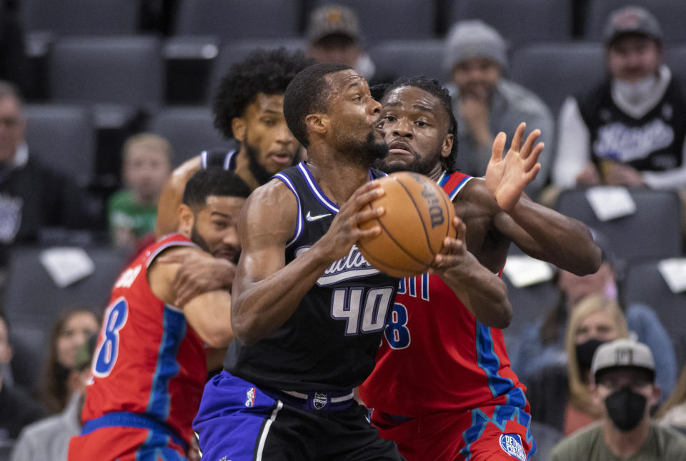 Sacramento Kings forward Harrison Barnes (40) is defended by Detroit Pistons forward Trey Lyles (8) during the first quarter of an NBA basketball game in Sacramento, Calif., Wednesday, Jan. 19, 2022. (AP Photo/José Luis Villegas)